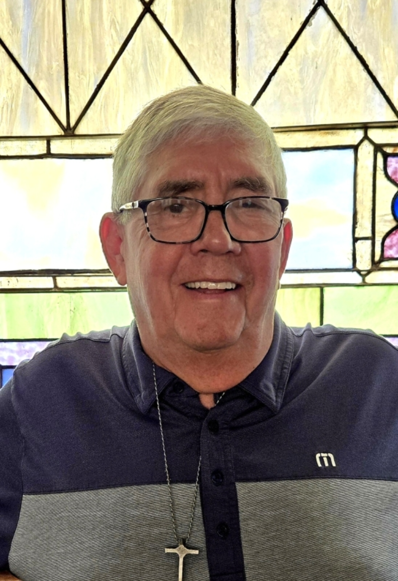 Smiling man wearing polo shirt indoors